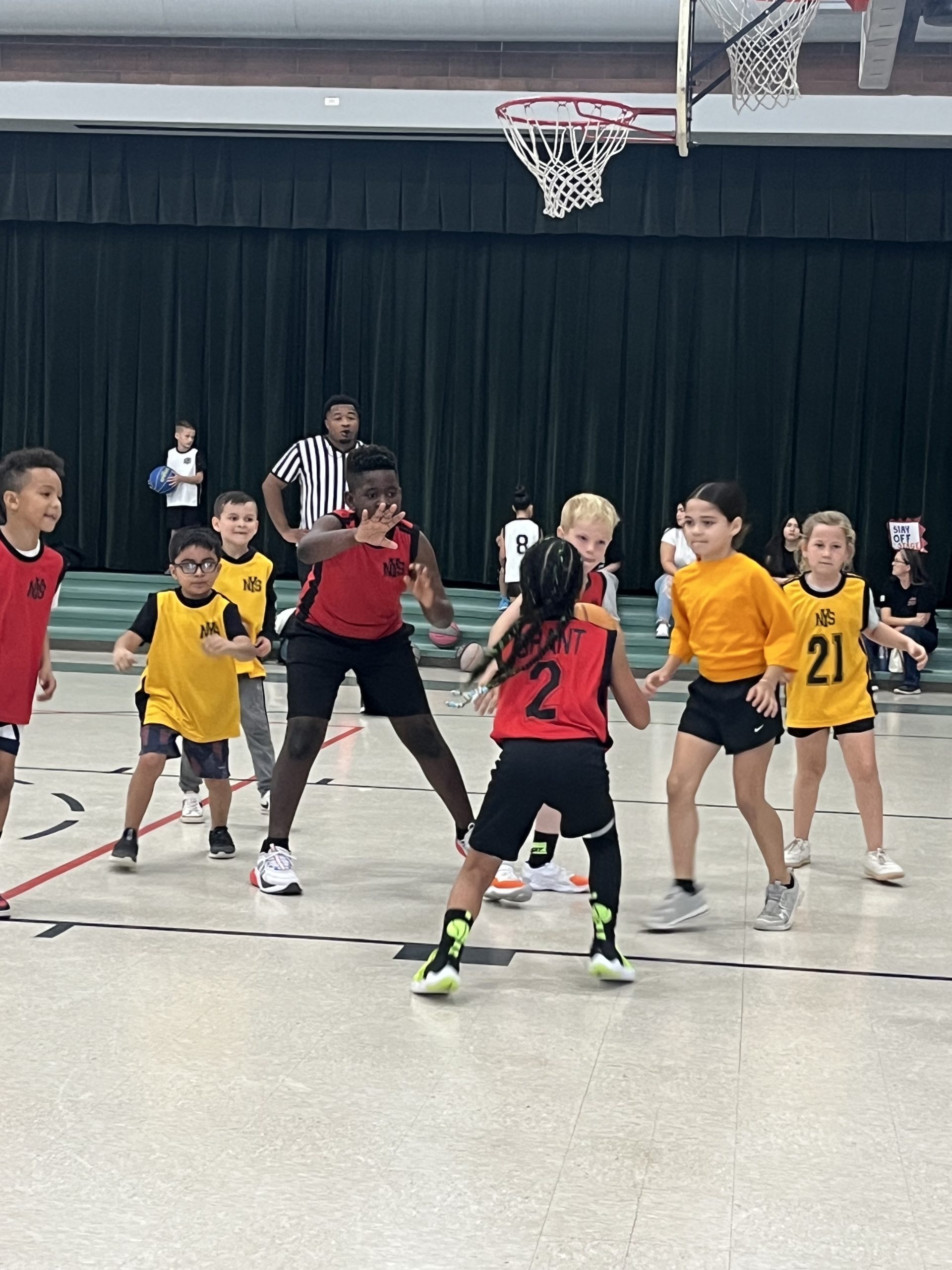 NYS Basketball player shooting a shot.